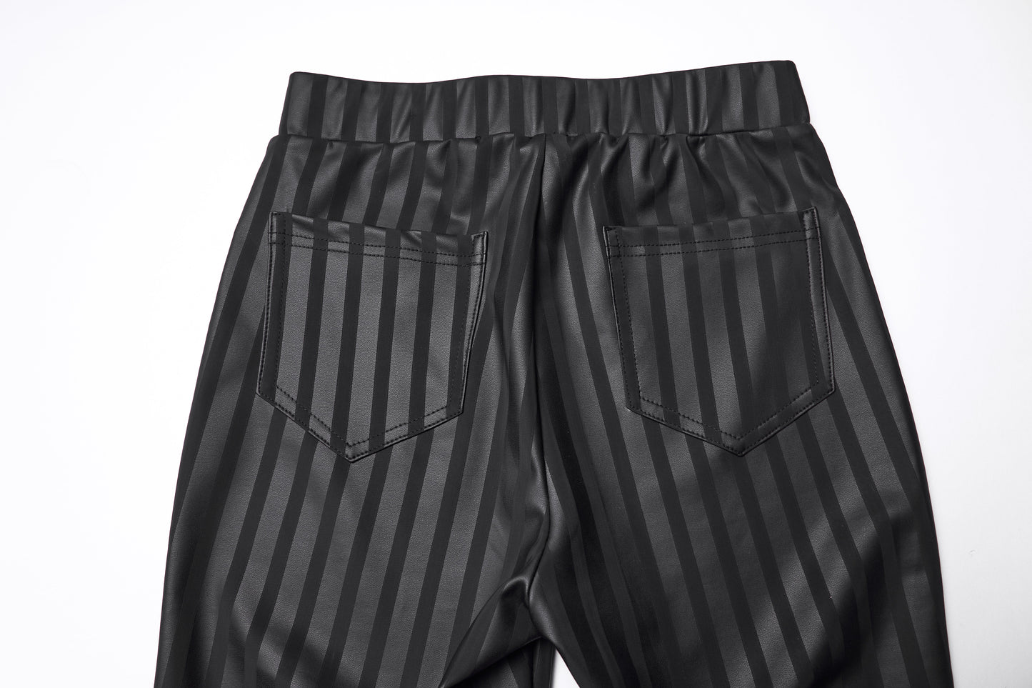 Model wearing Punk Rave Althea high-waisted leggings styled with vertical stripes and back patch pockets, demonstrating the luxurious fit and comfort in sizes ranging from F.XS to F.4XL.