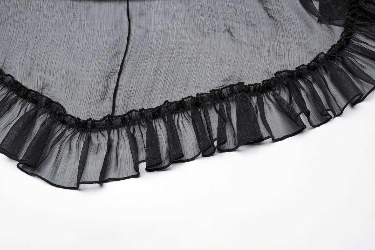 Close-up detail of the Punk Rave Dila chiffon skirt, highlighting the glossy twill fabric, adjustable side drawstrings, and stylish carved buttons.