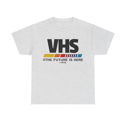 VHS Retro Logo Graphic Tee for Unisex in stylish grey showcasing a vintage-inspired design with striking text 'THE FUTURE IS HERE 1976', made from premium soft cotton for an effortlessly luxurious feel.