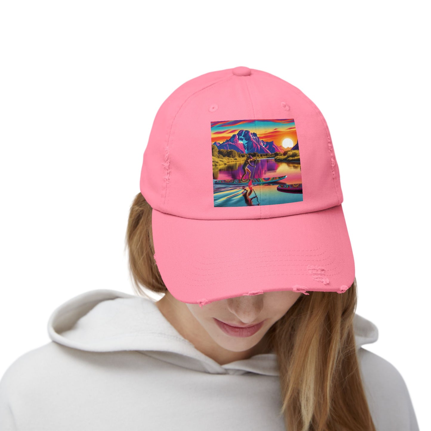 Unisex Distressed Paddleboarders Cap worn by a model, featuring a vibrant paddleboarding theme, combining luxury style with practical sun protection for adventure seekers.