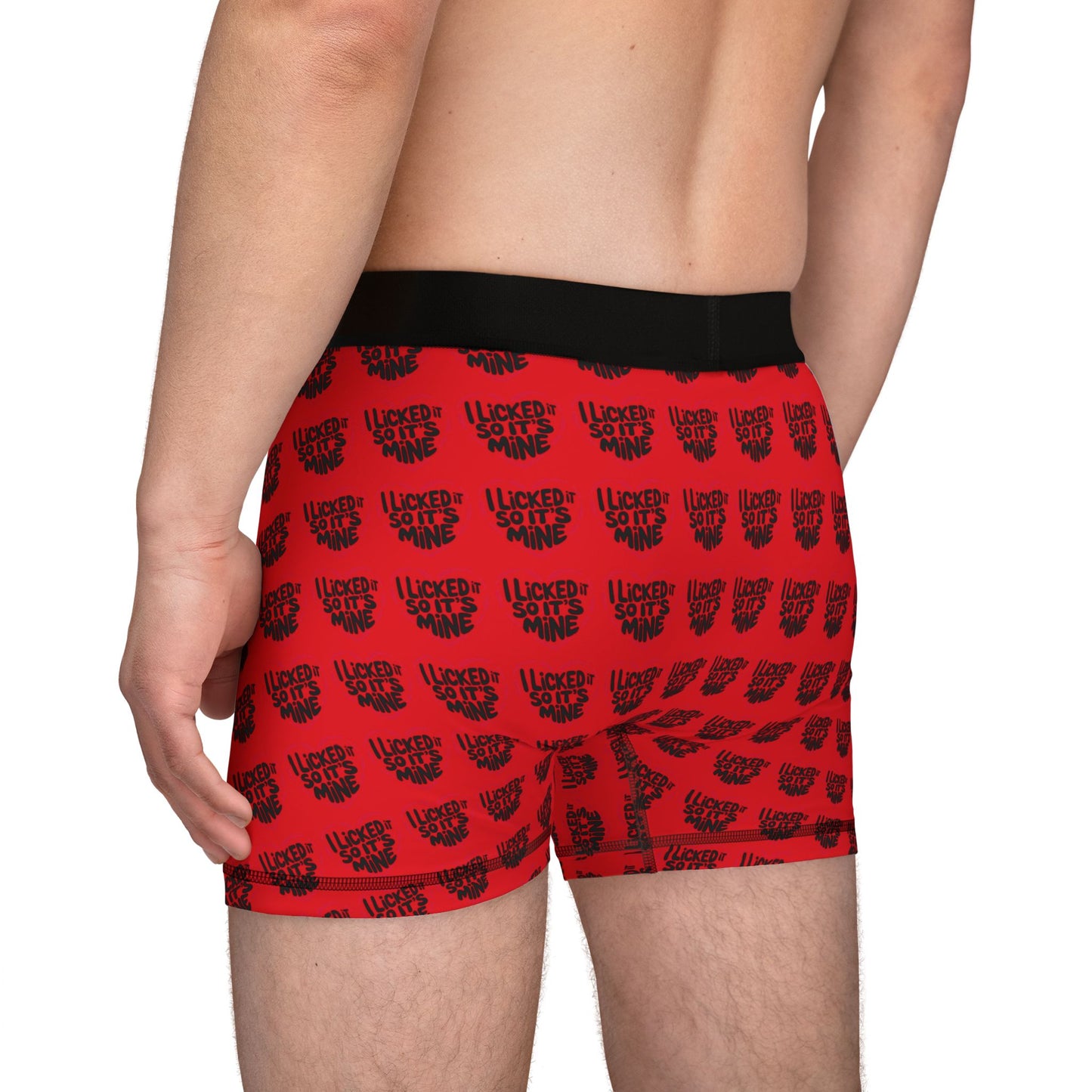 Side view of a model in Valentine's Naughty Cheeky Men's Boxer Briefs, highlighting the cheeky text 'I LICKED IT SO IT'S MINE', perfect for playful romantic occasions.