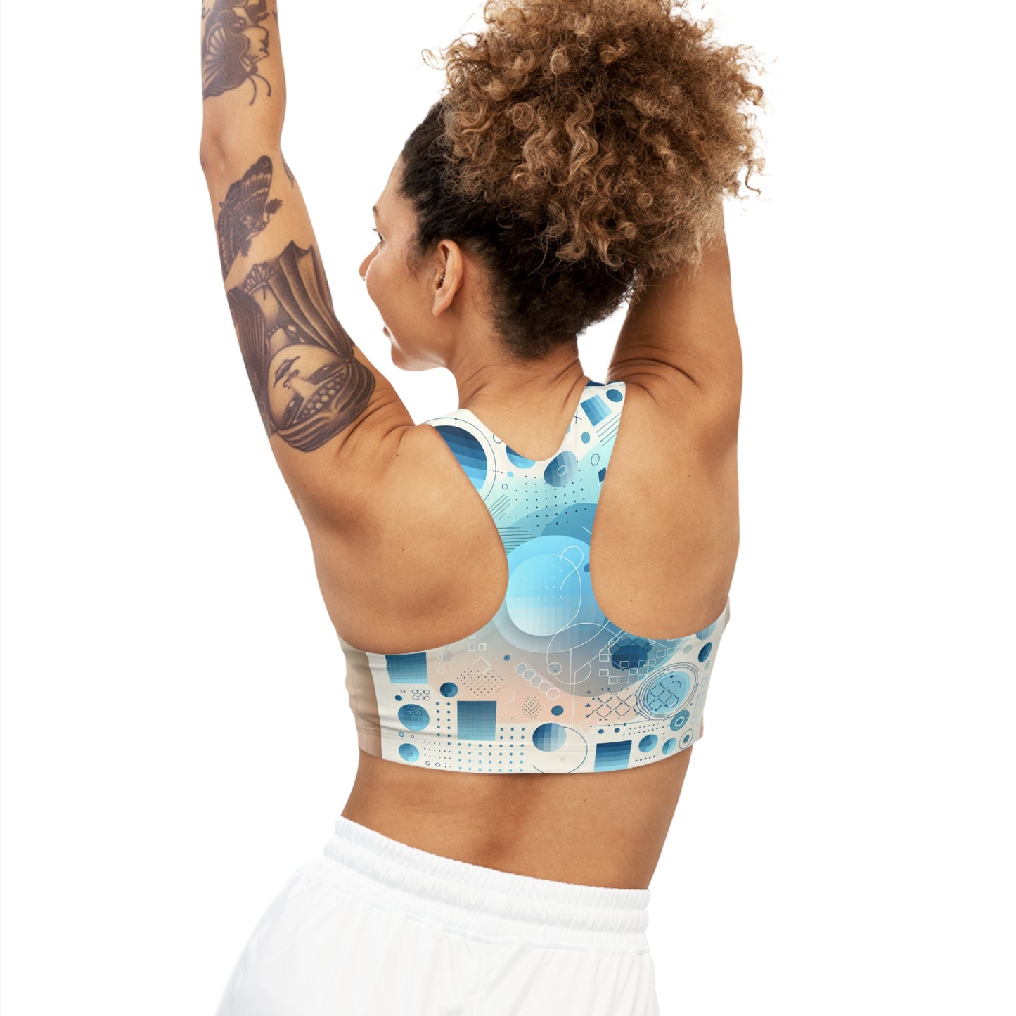 Back view of Sebastian Couture Women's Luxurious Abstract Sports Bra in Pastel Blue Gradation, demonstrating its stylish design and comfortable fit.
