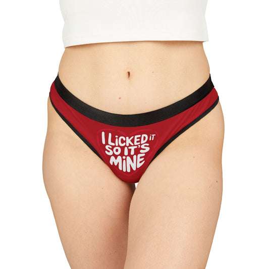 Stylish and cheeky Valentines Naughty Gift Womens Thong modelled, displaying bold text 'I Licked It So It’s Mine' on a striking red background, ideal for a fun and romantic celebration.
