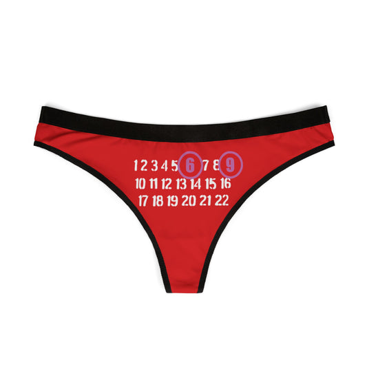 Chic red thong showcased flat with a humorous 69 design, elegantly crafted for a fun and flirtatious appeal, ideal for elevating confidence in intimate wear.