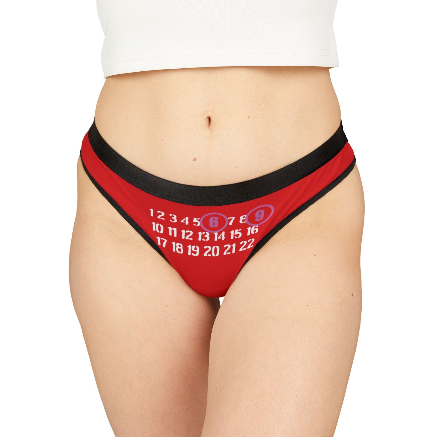 Stylish red thong on a model, featuring a cheeky 69 design, perfectly tailored for an alluring lingerie experience, exuding confidence and playful charm.
