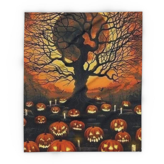 Decorative and Warm Halloween Spooky Arctic Fleece Blanket showcasing a captivating display of glowing jack-o'-lanterns beneath a gnarled tree silhouette at twilight.