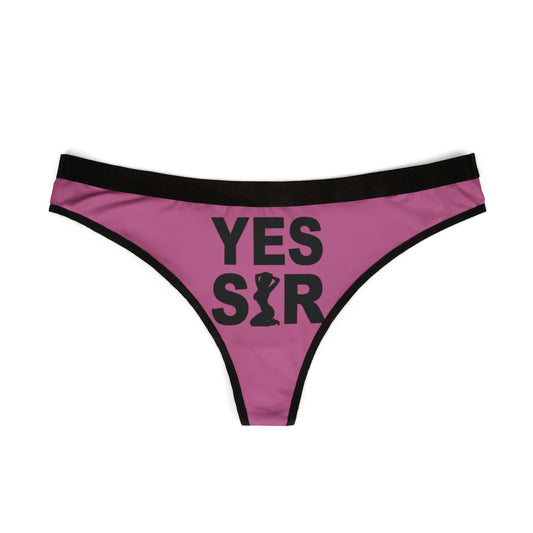 Stylish women's pink thong with eye-catching 'YES SIR' print, perfect for adding a cheeky touch to romantic occasions and special celebrations.