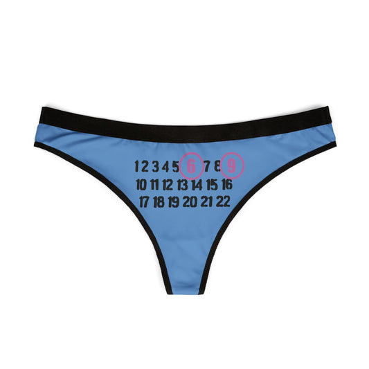 Elegant 69 thong displayed flat, showcasing its striking design with prominent numbers on a vibrant blue fabric.