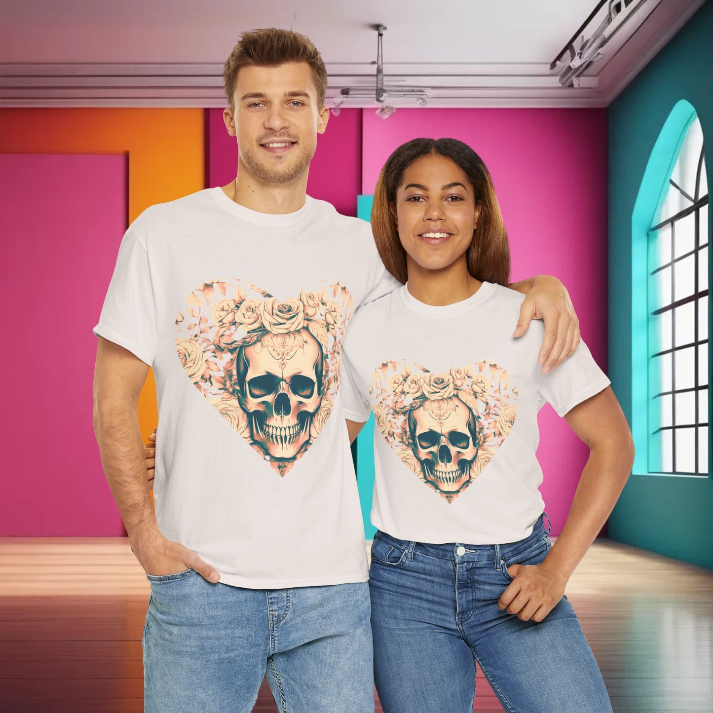 Couple wearing the Skulls and Roses Cotton Tee, Unisex Graphic Shirt, showcasing the elegant skull and rose graphic in a stylish indoor setting.