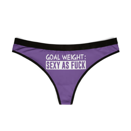 Chic women's thong showcasing a striking purple colour and provocative text 'Goal Weight: Sexy As Fuck', perfect for confident lingerie collection.