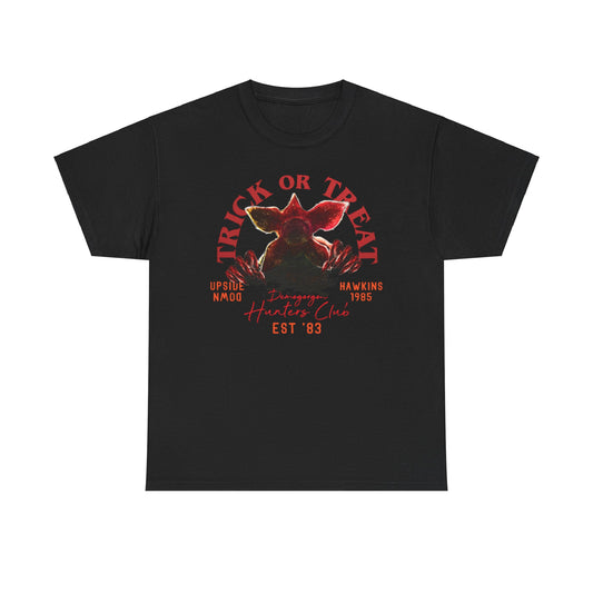 Sophisticated black unisex t-shirt adorned with an eye-catching Demogorgon illustration and bold 'TRICK OR TREAT' slogan, perfect for fans of the cult classic series, enhancing casual attire with a touch of luxe.