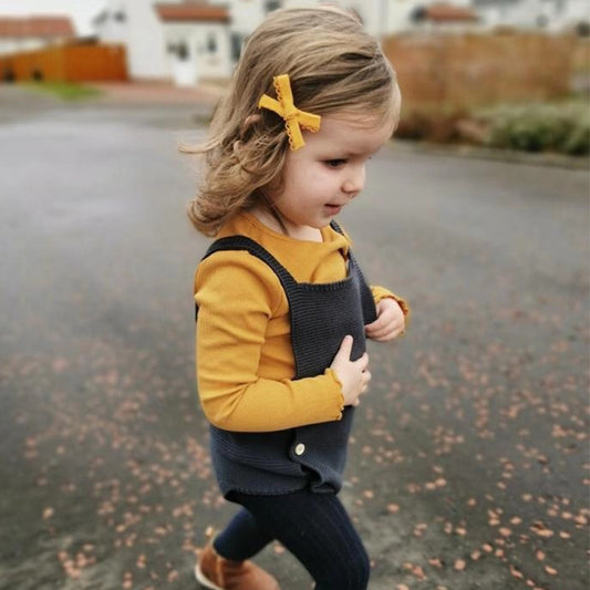 Stylish Baby Girl Cotton Romper on a child outdoors, showcasing all-season comfort and elegance for spring, autumn, and winter.