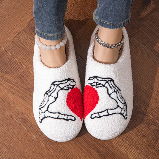 Funny Halloween Love Skull-hand Slippers featuring skull-hand design and heart motif, luxurious soft cotton material for comfort, perfect for winter home footwear.