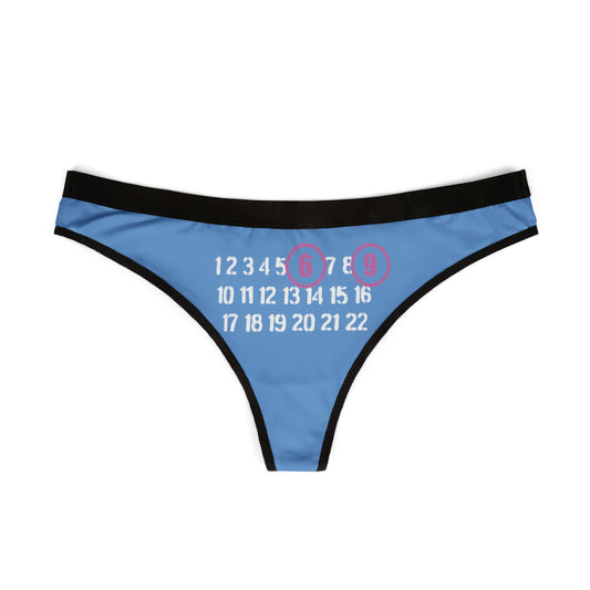 Stylish blue thong with a bold '69' graphic prominently displayed, accentuated by pinkish-purple circles, showcasing a blend of playful charm and elegant design for modern lingerie.