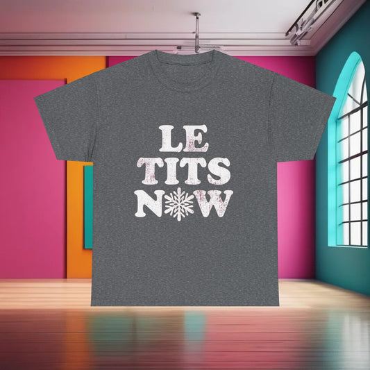 Let It Snow Christmas Graphic T-Shirt in grey, showcasing a whimsical design with the phrase 'LET IT SNOW', ideal for adding a touch of holiday cheer to your wardrobe.