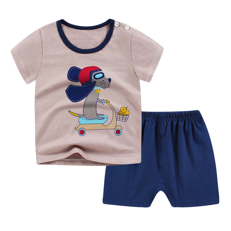 Luxury Summer Infant Newborn Baby Boy Clothes: Sophisticated beige 2-piece ensemble featuring a fun dog scooter graphic T-shirt and navy shorts, ideal for fashionable summer adventures.