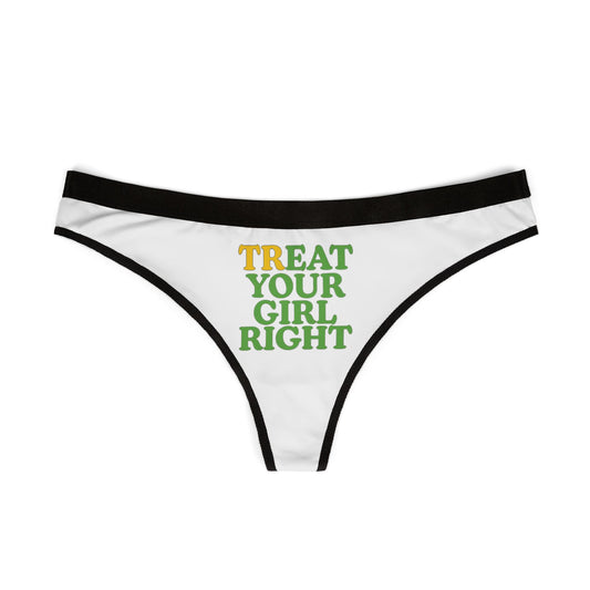 Exquisite white thong featuring playful 'TREAT YOUR GIRL RIGHT' phrase in eye-catching yellow and green, framed by a sophisticated black waistband.