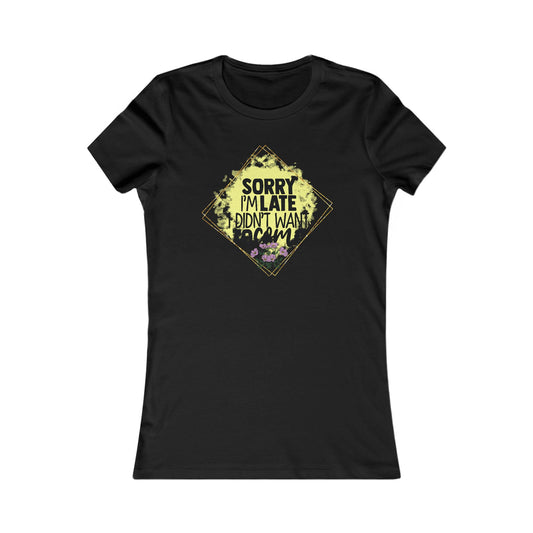 Chic black women's t-shirt showcasing a charming graphic design with the phrase 'Sorry I'm Late, I Didn't Want to Come', enhanced by elegant floral details and a sophisticated gold diamond border.