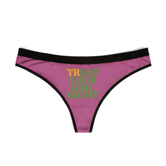 Chic women's thong underwear showcasing the vibrant 'TREAT YOUR GIRL RIGHT' slogan in striking yellow and green, set on a luxurious pink fabric with contrasting black trim.