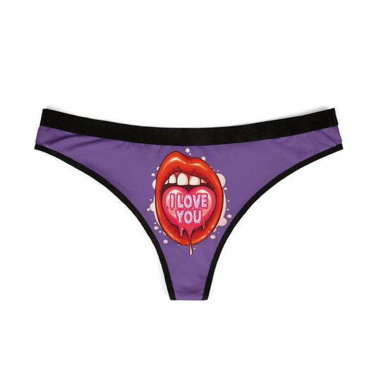 Luxury women's thong featuring a playful design of red lips with a heart-shaped tongue that says 'I love you', set against a vibrant purple background, perfect for cheeky romantic gifts.