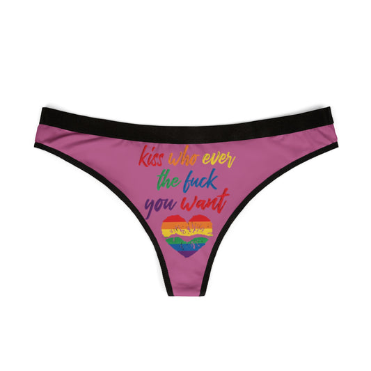 An exquisite women's thong presented flat, adorned with a bold graphic that reads 'Kiss who ever the f*** you want.' The design includes a striking rainbow heart, embodying a fun and sassy approach to intimate apparel.