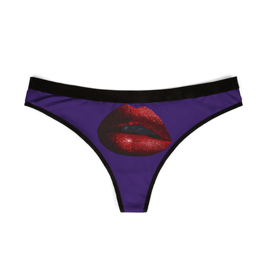 Elegant women's thong displaying an eye-catching illustration of sparkling red lips on a purple fabric, ideal for cheeky celebrations.
