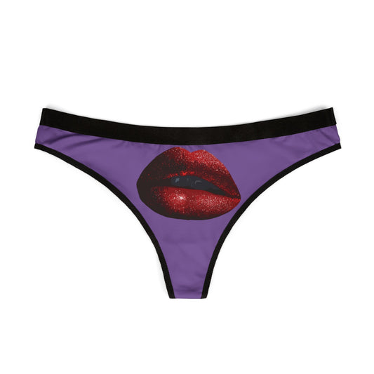 Elegant women's thong showcasing a striking illustration of sparkling red lips on a rich purple fabric, perfect for adding a cheeky touch to intimate moments.