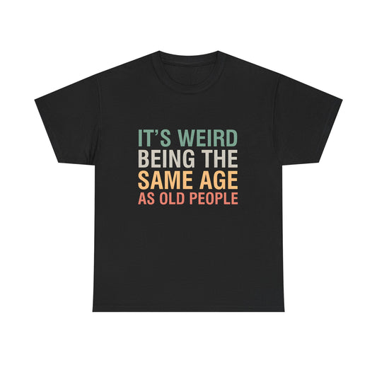 An elegant black urban unisex cotton T-shirt showcasing the quirky phrase 'It’s Weird Being The Same Age As Old People' in stylish typography, ideal for adding a touch of humor to your wardrobe.