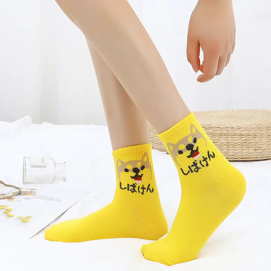 Stylish Hip Hop Long Socks for Women & Girls featuring a playful cartoon design with a bright yellow background, made from a comfortable cotton and polyester blend.