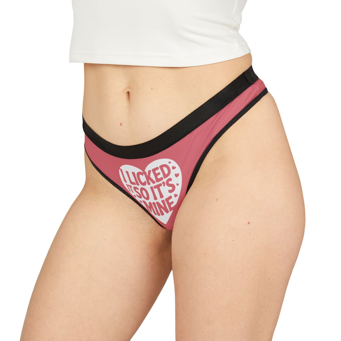 Close-up of Valentine's Naughty Gift Cheeky Women's Thong, displaying 'I Licked It So It’s Mine' statement, luxurious fabric and stylish black waistband.