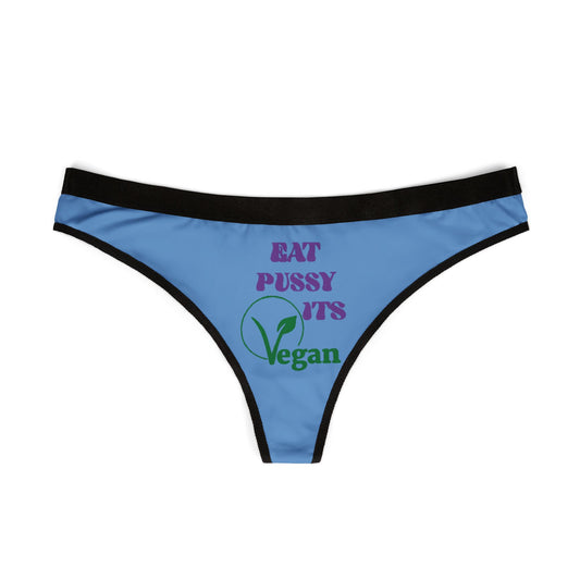 Elegant blue thong panties adorned with the phrase 'Eat Pussy, It's Vegan' in vibrant colours, expertly designed with a flattering black waistband, perfect for adding a touch of playfulness to luxurious lingerie collections.