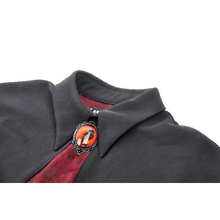 Elegant model wearing the Dark In Love Camazotz Bat Capelet, embodying a regal gothic style accentuated by the striking red elements and luxurious fabric.
