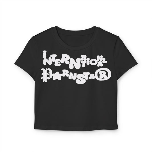 Luxurious women's cropped baby t-shirt in classic black featuring a playful white graphic reading 'International Parnstar', perfect for stylish casual wear.