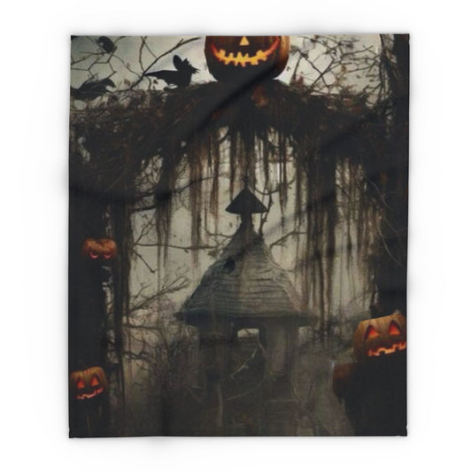 Decorative and Warm Halloween Spooky Arctic Fleece Blanket featuring a haunting scene with jack-o'-lanterns, dark trees, and a mysterious old house, perfect for adding a festive touch to your Halloween decor.