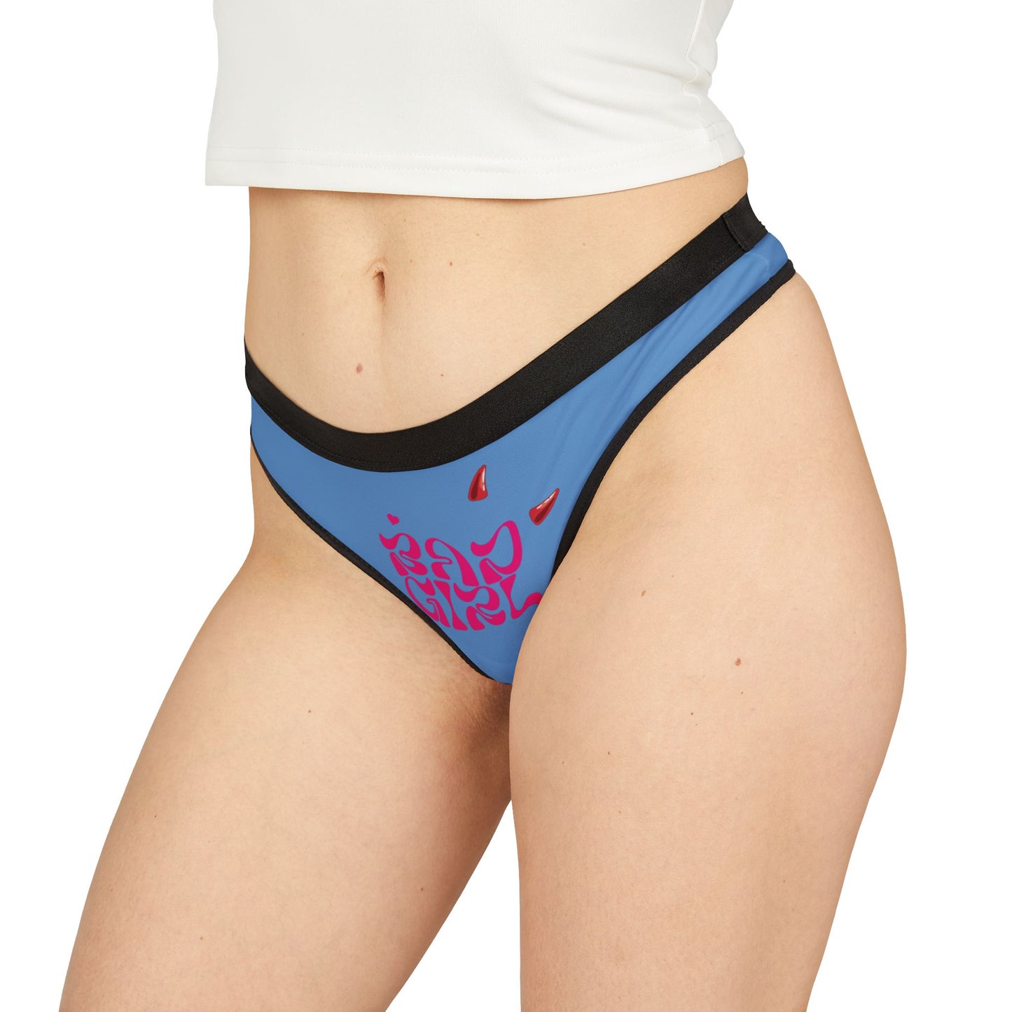 Sophisticated hot pink 'Bad Girl' thong panties modeled on the side, emphasizing luxury design with bold typography and smooth fit for modern allure.