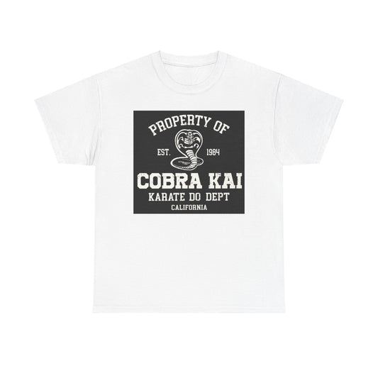 Elegant white unisex graphic t-shirt featuring the Cobra Kai logo, a striking design that embodies martial arts spirit with a vintage appeal.