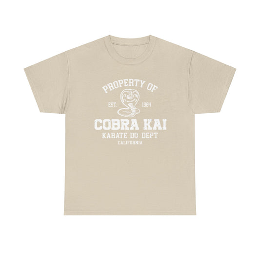 Luxurious graphic tee featuring the iconic Cobra Kai emblem, with 'Property of Cobra Kai Karate Do Dept' lettering, styled in a classic beige colourway.