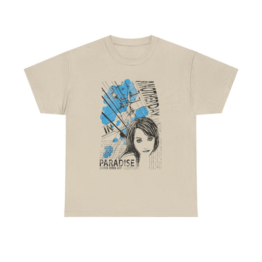 Elegant beige t-shirt adorned with a sophisticated graphic illustration of a woman's face, complemented by blue artistic elements and urban motifs, ideal for fashion enthusiasts wanting to express their unique style.