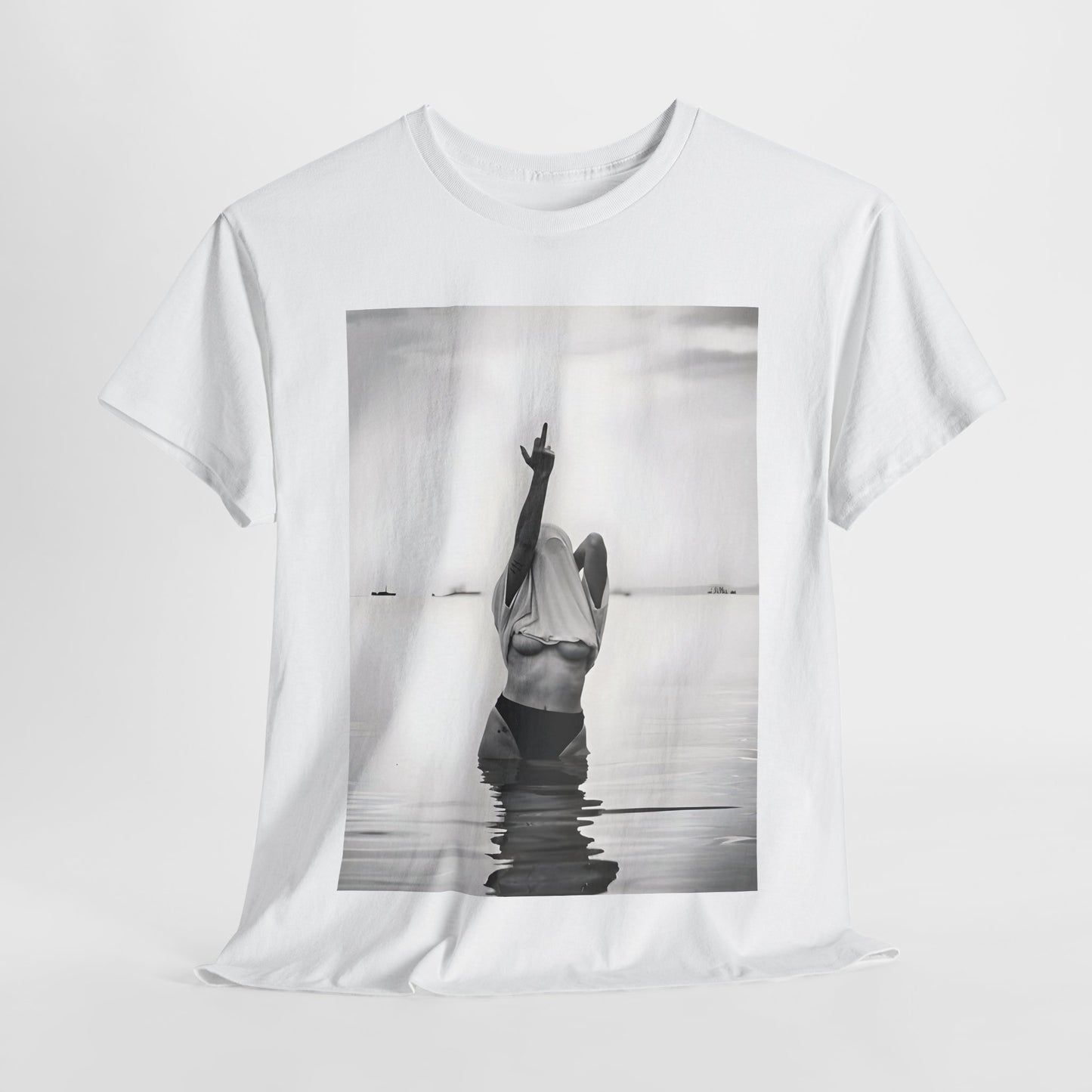 Middle Finger Girl Graphic T-Shirt showcasing a striking black and white design of a woman boldly raising her arm in calm waters, epitomising individuality and resilience. Perfect urban unisex cotton tee for effortless style.