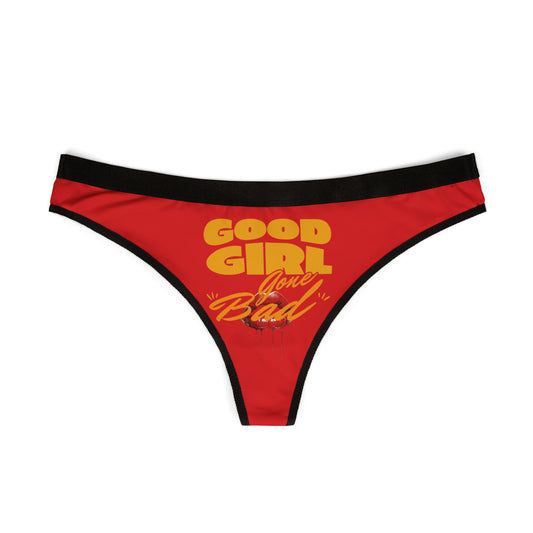 Stylish flat lay of 'Good Girl Gone Bad' thong panties featuring a vivid red colour and striking typography for a luxurious appeal.