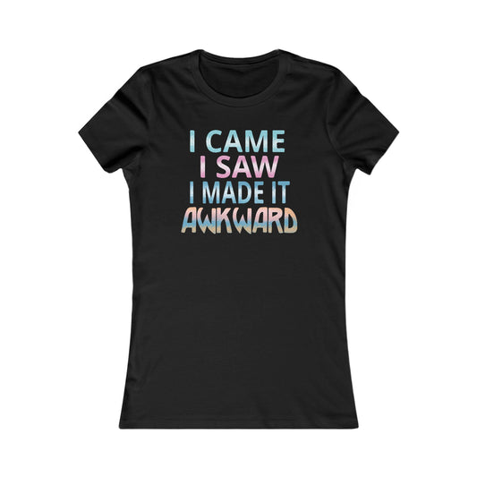 Sophisticated black women's t-shirt adorned with the whimsical text 'I CAME I SAW I MADE IT AWKWARD' in shimmering pastel hues, perfect for a stylish statement.