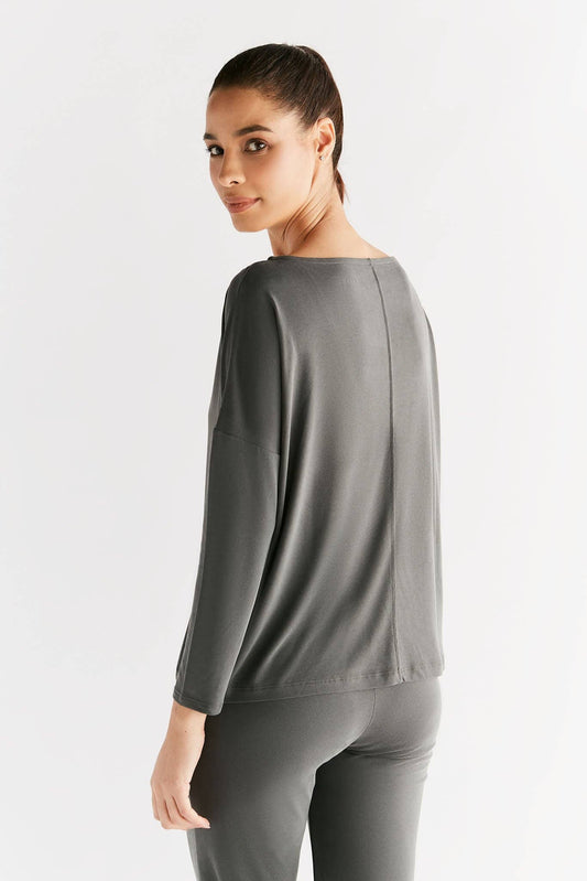 Elegant Women's Eco-Friendly Tencel Long Sleeve Yoga Shirt showcasing luxurious moisture-regulating fabric and a comfortable cut.