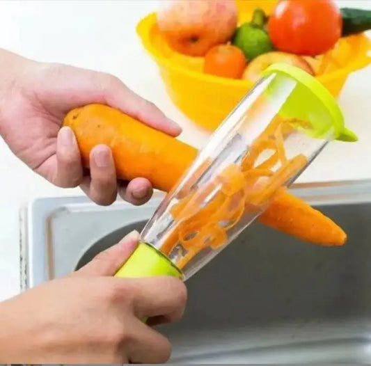 Chic stainless steel peeler in use, featuring a vibrant green handle, showcasing easy peeling of a fresh carrot, embodying culinary sophistication and efficiency.