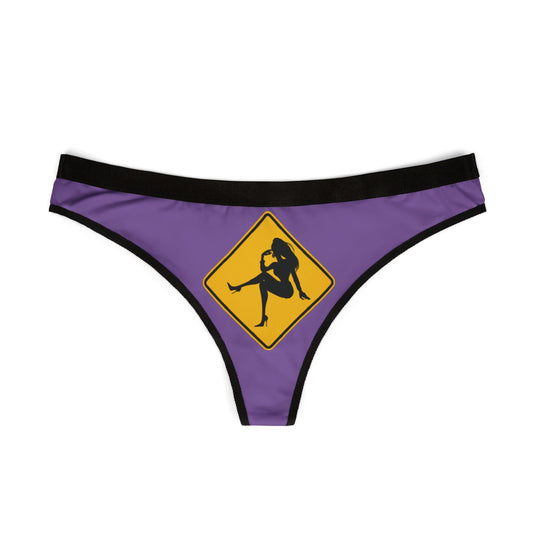 Elegant women's graphic thong in vibrant purple with a playful warning sign motif, featuring a silhouette design, perfect for romantic occasions.