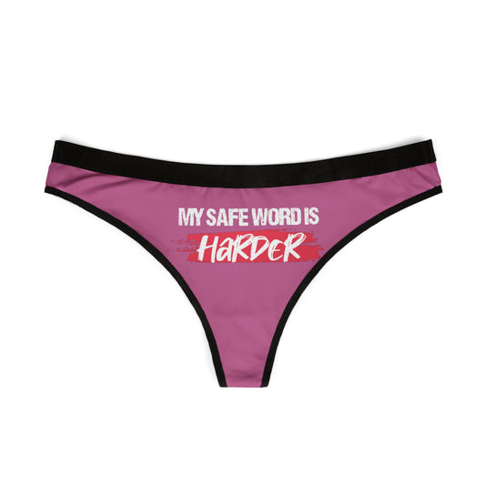Elegantly crafted pink women's thong showcasing the cheeky text 'MY SAFE WORD IS HARDER', complemented by a chic black trim, perfect for adding a daring touch to intimate apparel.