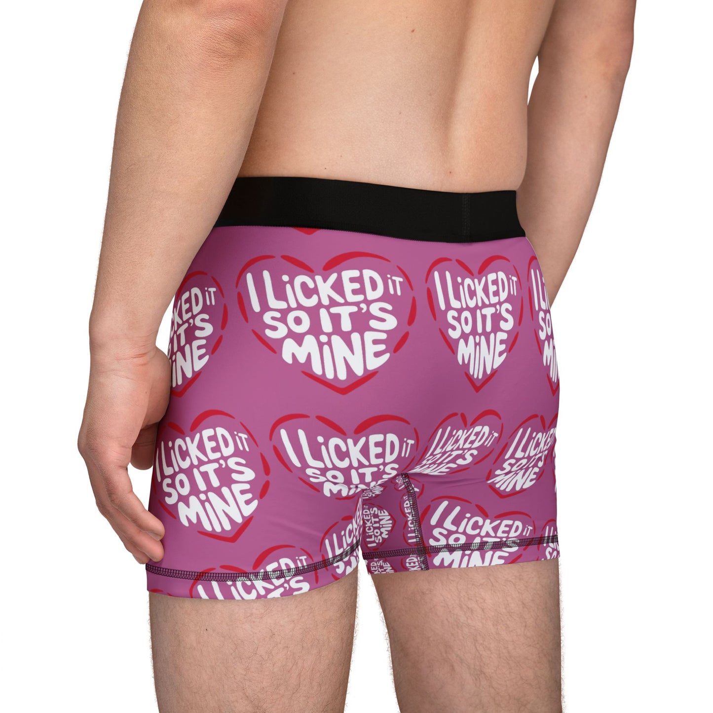 Valentine's Naughty Cheeky Men's Boxer Briefs captured from the back, featuring a playful heart design with the phrase 'I LICKED IT SO IT'S MINE', perfect for adding fun to romantic moments.
