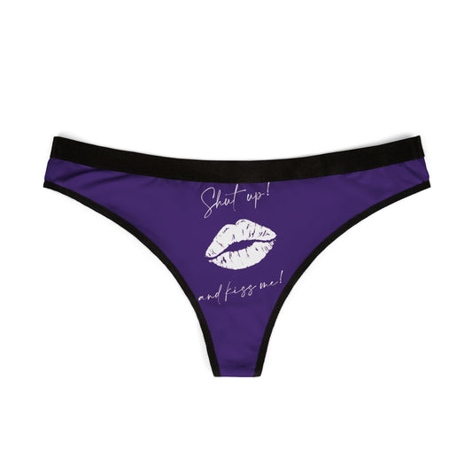 Luxurious women's thong underwear in vibrant purple, featuring playful text that reads 'Shut up! and kiss me!' alongside a stylish lip print, perfect for adding a cheeky twist to intimate occasions.