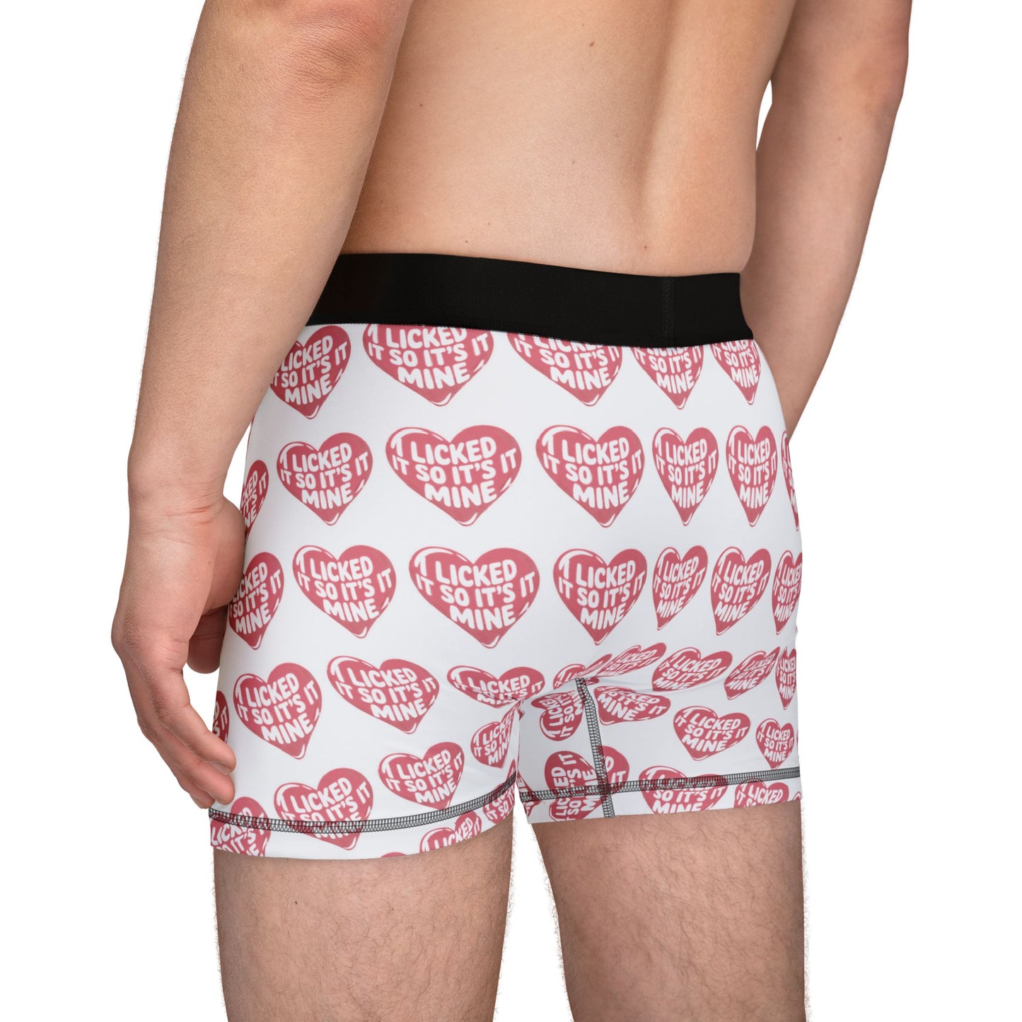 Side view of a model in Valentines Naughty Cheeky Mens Boxer Briefs highlighting the fun and cheeky message in a luxurious presentation.