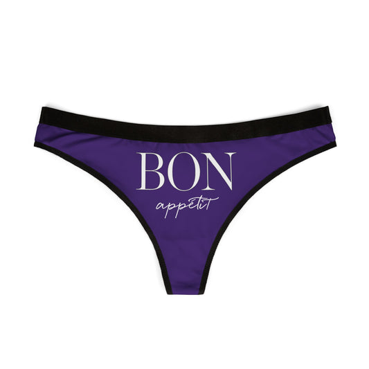 Chic purple thong featuring the whimsical phrase "BON appétit" in stylish font, perfect for adding a cheeky touch to intimate apparel.