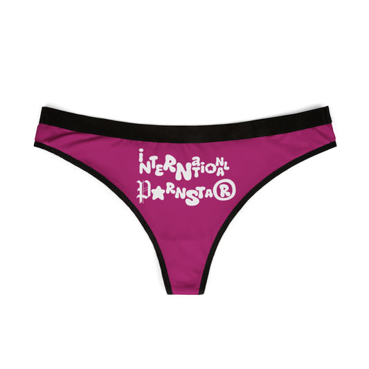 Stylish International Star Thong in rich purple with striking white lettering, exhibiting a modern and cheeky design perfect for bold women.